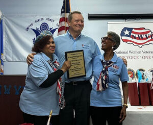United Relief Foundation president Frank Salato receiving an award from the National Women Veterans United